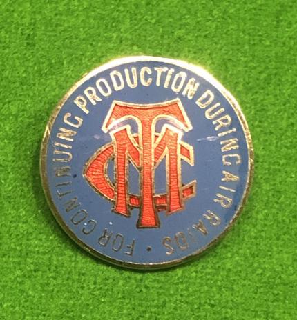 Production During Air Raids Lapel Badge.